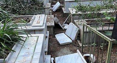 İzmir'de vandalizm kurbanı 39 mezarda çalışma başlatıldı